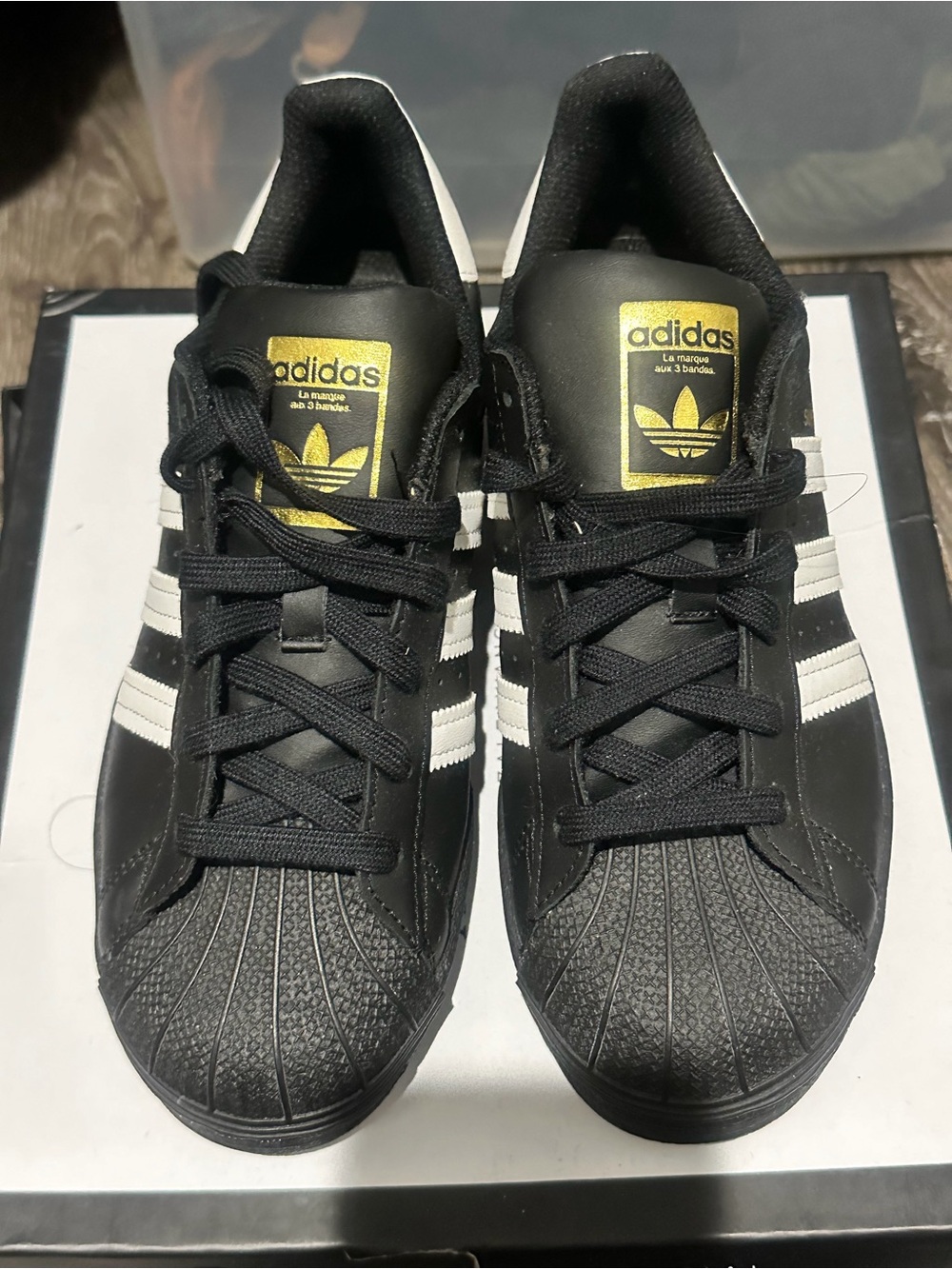 adidas Black & White Sneakers with Gold Logo Accents